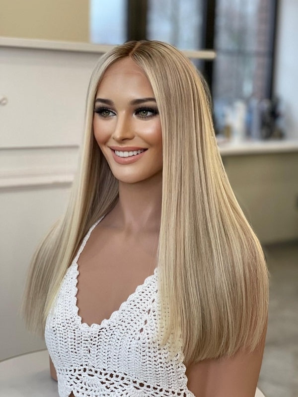 Beautiful long, blond, human hair wig. The mix of sandy blond, honey blond, and platinum tones matches any skin tone. Glueless, lace-top wig. Medical Wigs Femperial